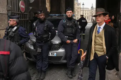 Who Was the Fedora-Clad Man at the Louvre Heist? The Internet Has Theories