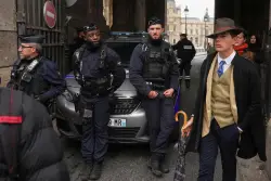 Who Was the Fedora-Clad Man at the Louvre Heist? The Internet Has Theories